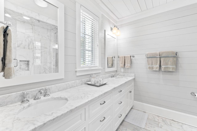 bathroom featuring a healthy amount of sunlight, tile floors, double vanity, and crown molding