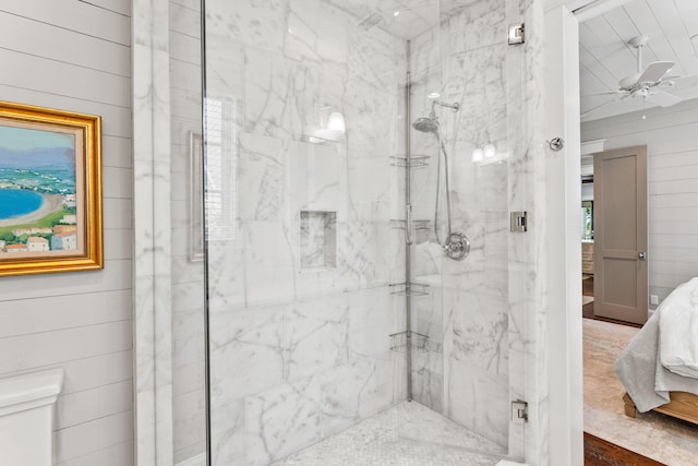 bathroom featuring a shower with door