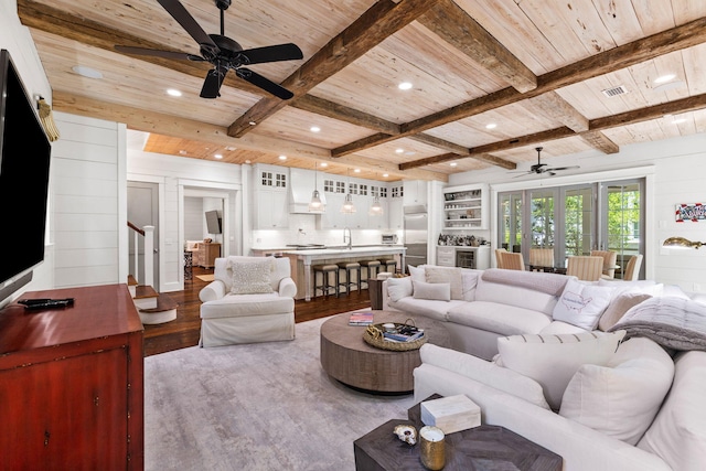 living room featuring wood-type flooring, ceiling fan, french doors, and wood ceiling