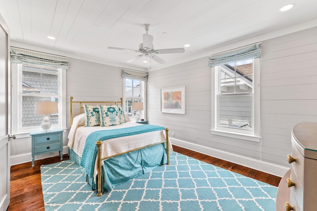 bedroom with ceiling fan and dark hardwood / wood-style flooring