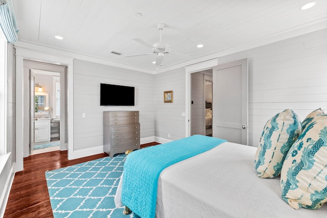 bedroom featuring ornamental molding, ceiling fan, and dark hardwood / wood-style floors