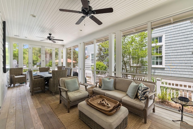 sunroom featuring wood ceiling, french doors, and ceiling fan