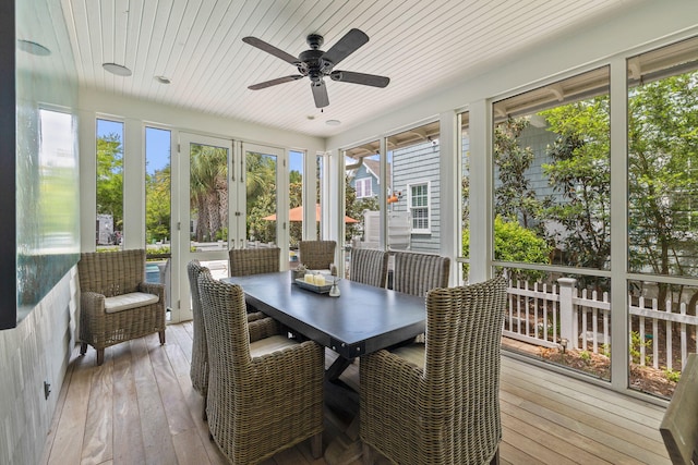 sunroom / solarium featuring ceiling fan, french doors, and wood ceiling