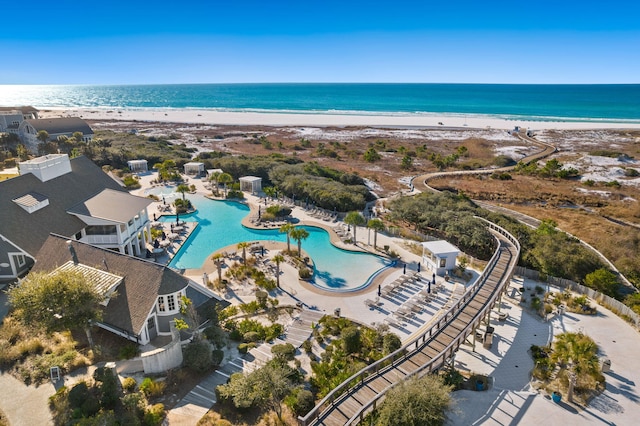 bird's eye view featuring a view of the beach and a water view