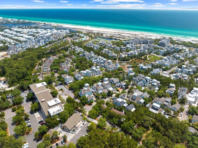 drone / aerial view featuring a view of the beach and a water view