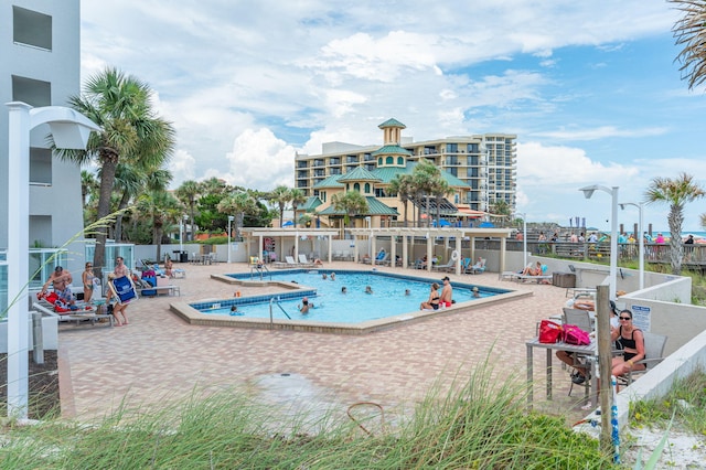 view of swimming pool with a patio