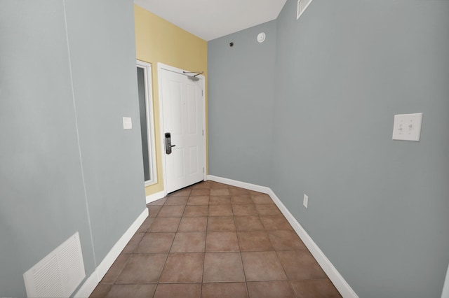 hallway with tile flooring