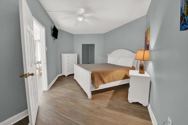 bedroom featuring ceiling fan and hardwood / wood-style floors