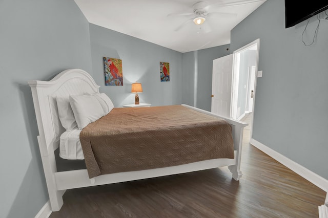 bedroom featuring ceiling fan and dark hardwood / wood-style floors