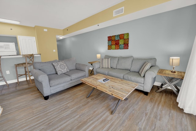 living room with wood-type flooring