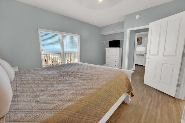 bedroom with hardwood / wood-style floors