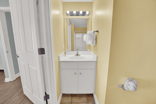 bathroom with vanity with extensive cabinet space and tile flooring