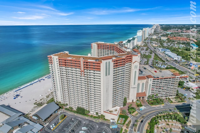 birds eye view of property with a view of the beach and a water view