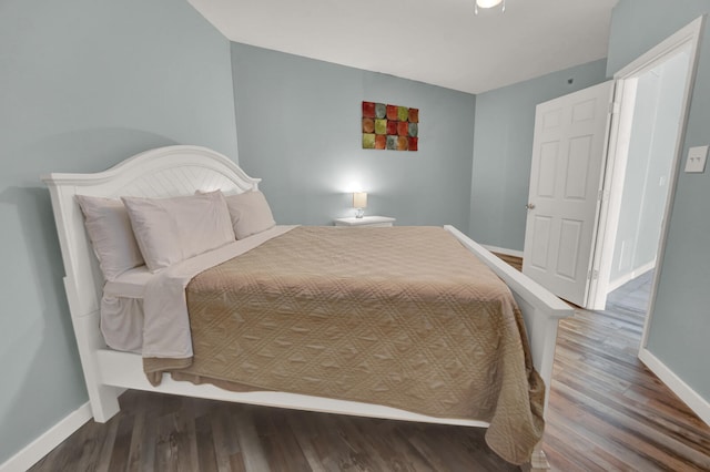 bedroom featuring dark hardwood / wood-style flooring