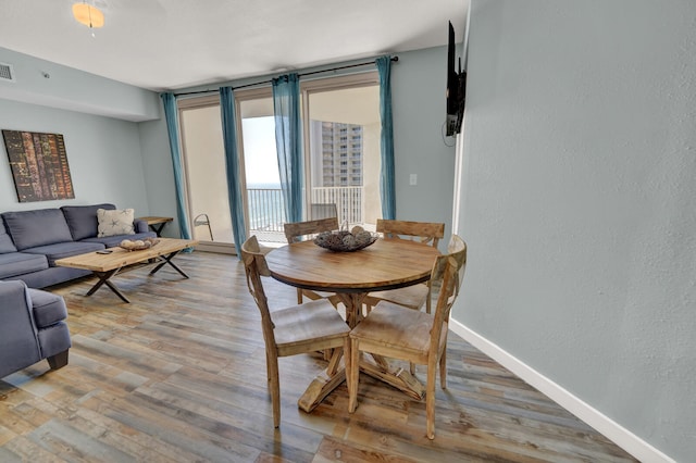 dining room with hardwood / wood-style flooring