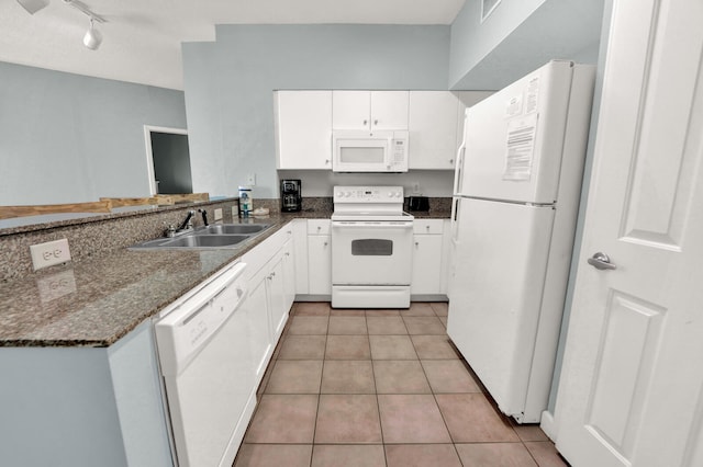 kitchen with white appliances, light tile flooring, white cabinetry, rail lighting, and sink