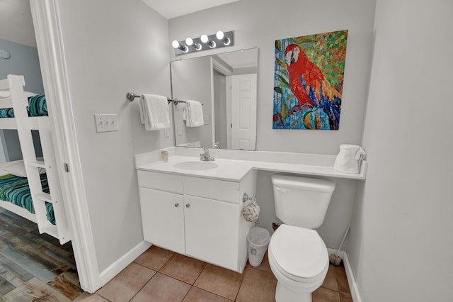 bathroom featuring tile floors, toilet, and oversized vanity