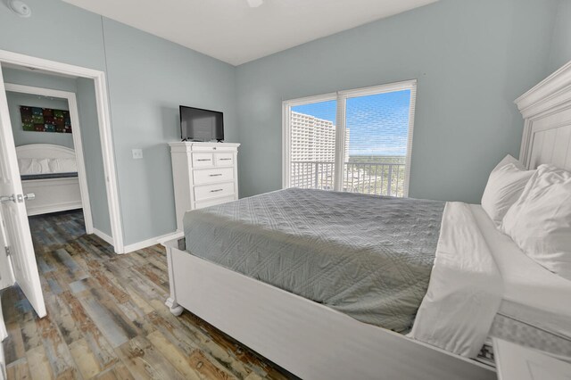 bedroom with hardwood / wood-style flooring