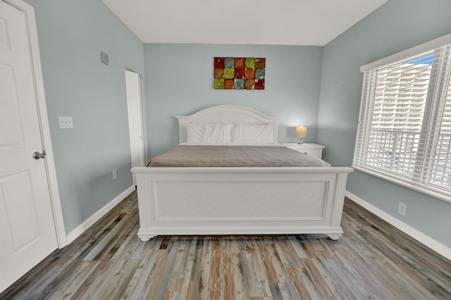 bedroom featuring dark hardwood / wood-style floors