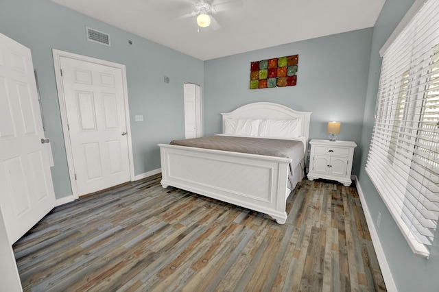 bedroom featuring dark hardwood / wood-style flooring and ceiling fan