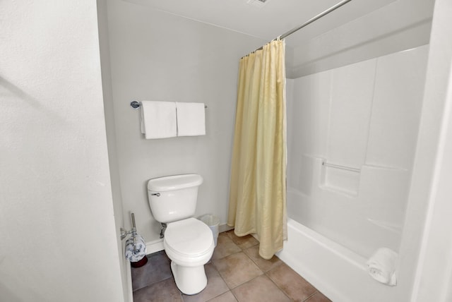 bathroom featuring toilet, tile flooring, and shower / tub combo with curtain