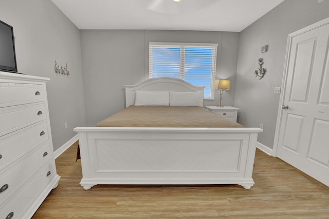 bedroom with light hardwood / wood-style floors