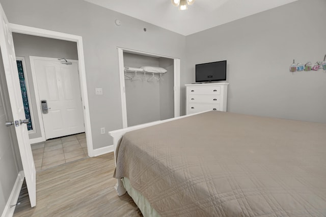 bedroom featuring a closet and light hardwood / wood-style floors