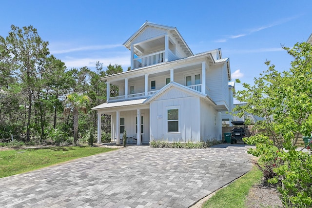 view of front of home with a balcony and a porch