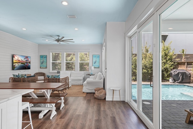 dining room featuring dark hardwood / wood-style flooring and ceiling fan