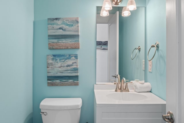 bathroom with toilet and vanity