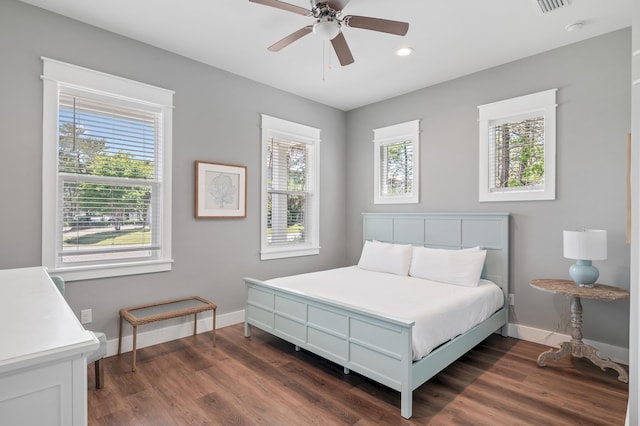 bedroom featuring dark wood-type flooring and ceiling fan