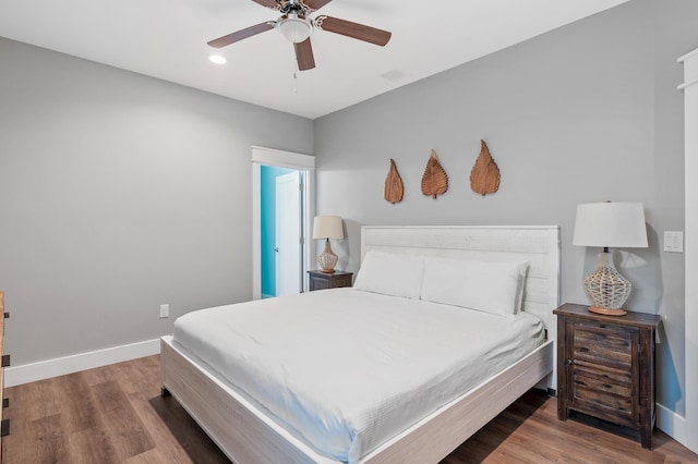 bedroom with wood-type flooring and ceiling fan