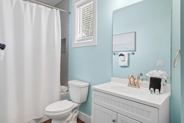 bathroom featuring toilet and vanity