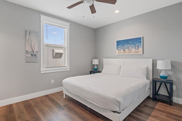 bedroom featuring dark hardwood / wood-style flooring and ceiling fan