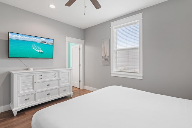 bedroom featuring ceiling fan and dark hardwood / wood-style floors