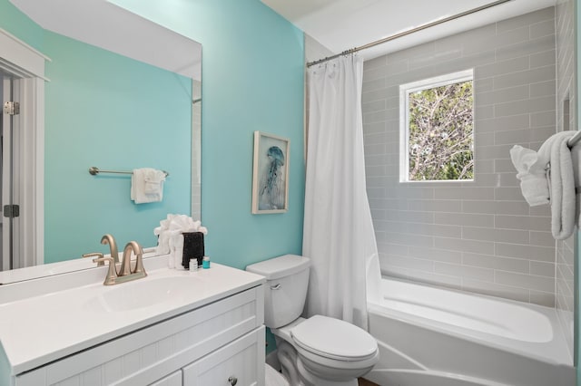 full bathroom featuring toilet, shower / tub combo with curtain, and large vanity