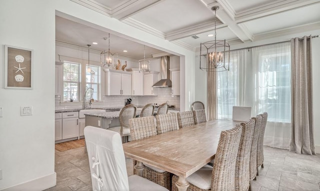 dining space with coffered ceiling, crown molding, sink, beamed ceiling, and a notable chandelier