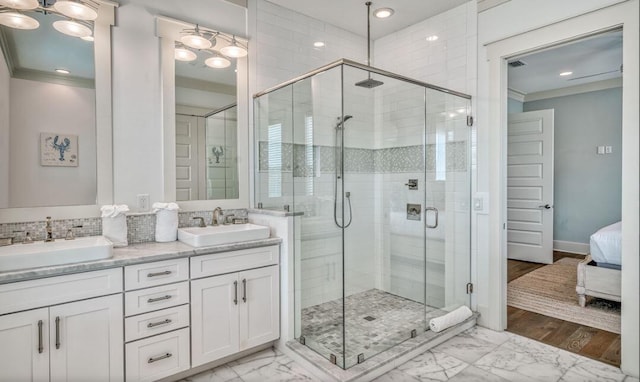 bathroom with vanity, walk in shower, and ornamental molding