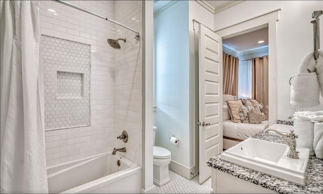 full bathroom featuring shower / bathtub combination with curtain, tile patterned floors, toilet, vanity, and ornamental molding