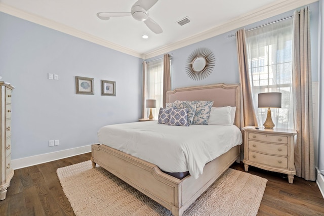 bedroom with ceiling fan, ornamental molding, and dark wood-type flooring