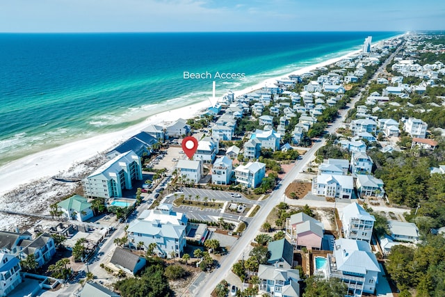 bird's eye view with a view of the beach and a water view