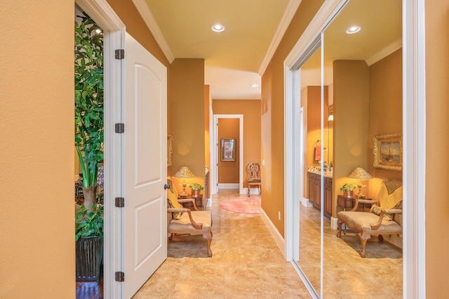 hall featuring crown molding and light tile floors