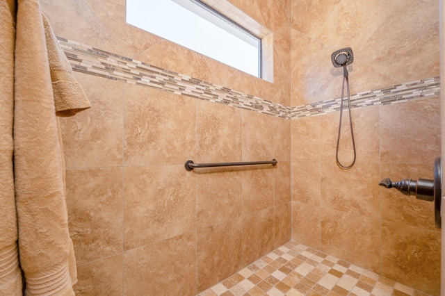 bathroom with tiled shower