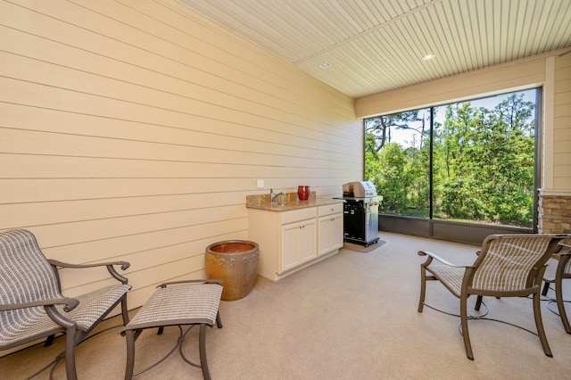 sunroom featuring wood ceiling