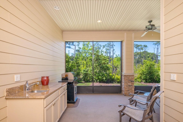 view of patio / terrace with sink, ceiling fan, and grilling area