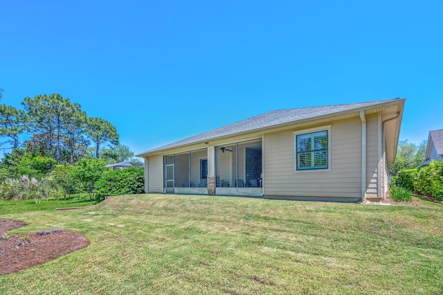 back of property featuring a yard