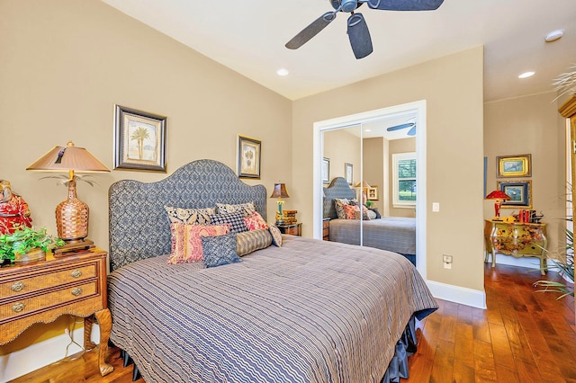 bedroom featuring hardwood / wood-style floors and ceiling fan