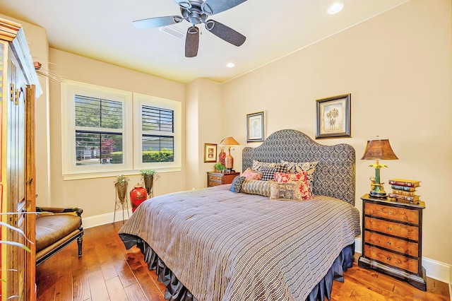 bedroom with wood-type flooring and ceiling fan