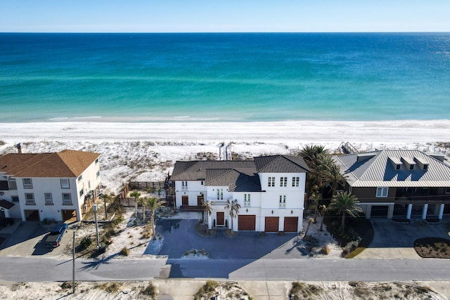 bird's eye view featuring a beach view and a water view