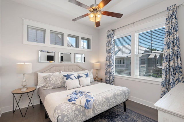 bedroom with ceiling fan and hardwood / wood-style flooring